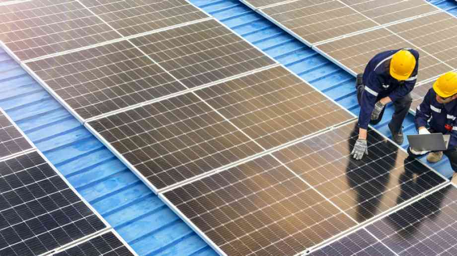 Builders installing solar panels Builders installing solar panels