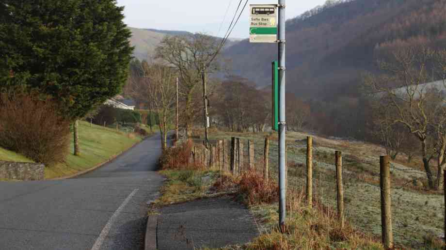 A bus stop on a rural Welsh road.