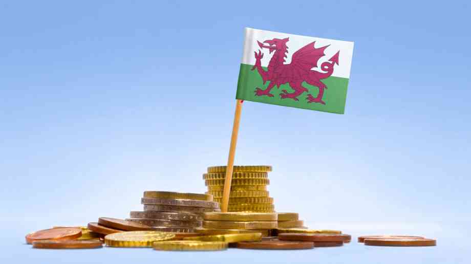 Welsh flag on a stack of coins.