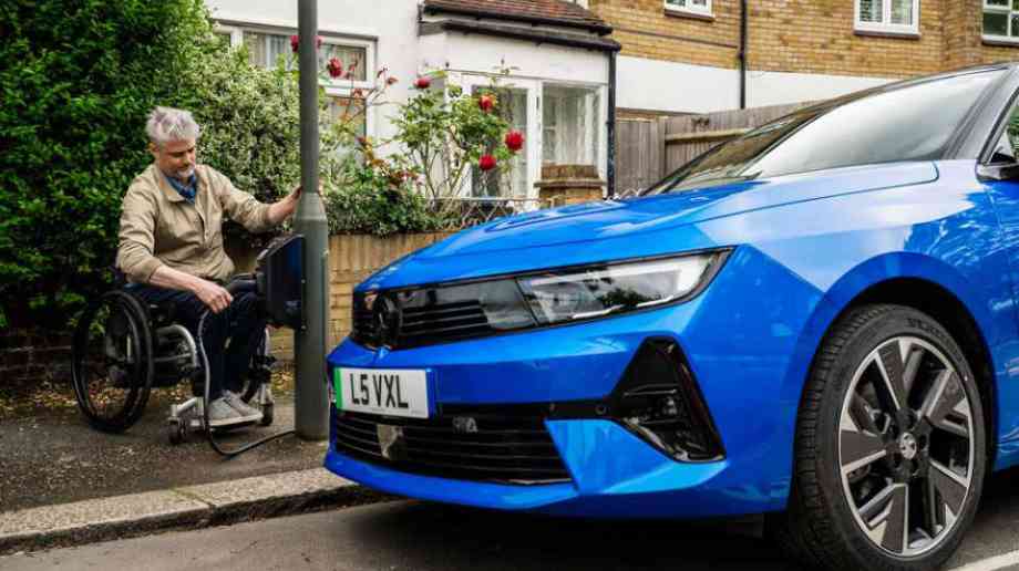 Disabled person next to EV Disabled person next to EV