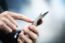 A person using a smart phone
